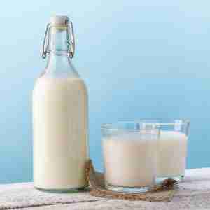 Milk. Bottle and glass with milk.